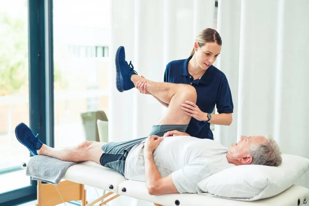 Revitalising Recovery: Effective Rehabilitation Strategies for Muscle Injuries 3 Physiotherapist assisting a patient with muscle recovery exercises Peterborough