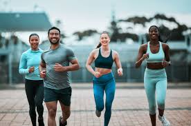 Sculpting Sleek Arms: The Essential Role of Cardio in Toning Without Bulking Up 3 image of people running to incorporate cardio Peterborough exercise into their life to help tone arms and body.