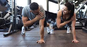 Sculpting Sleek Arms: The Essential Role of Cardio in Toning Without Bulking Up 1 Image of man and woman doing Cardio Peterborough to tone their arms.